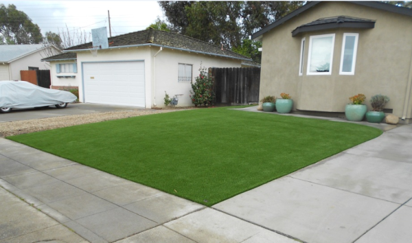 synthetic grass installation at your home for outdoor living spaces
