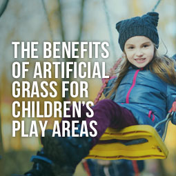 little girl swinging on swing in childrens play area and benefits of artificial grass