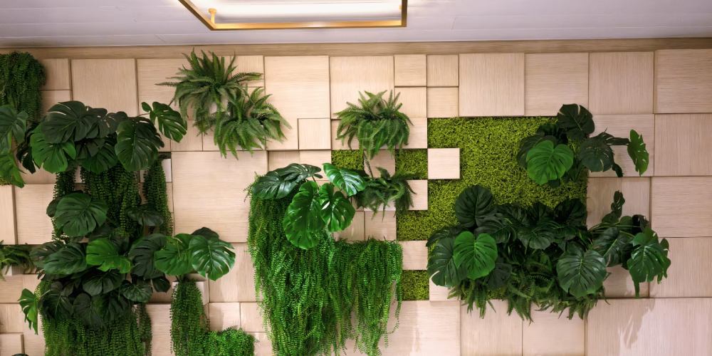 Vertical garden featuring artificial grass and lush greenery integrated into wall panels, showcasing innovative landscaping design ideas for indoor spaces.